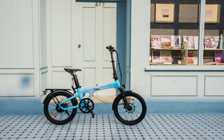 The light blue gradient Air 20 Ultra is parked in front of the store
