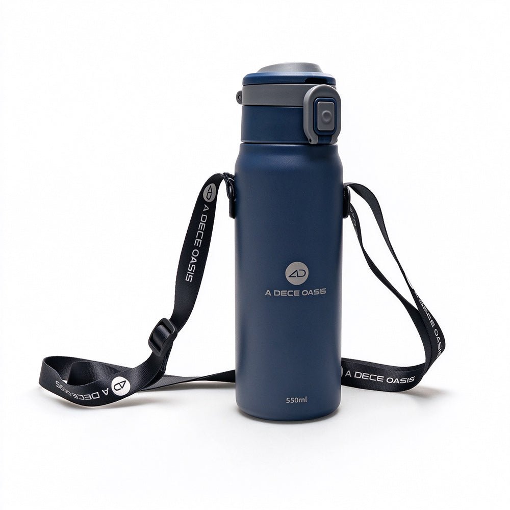 Rear view of the dark blue ADO insulated bottle showing the integrated AQS Mag quick-release interface and the black adjustable carry strap.Dark blue
